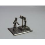 A Dutch Silver Miniature Man in the Stocks - It has the Lion Passant, Makers Mark and Date Mark, pre