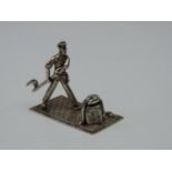 A Dutch Silver Miniature Man with an Axe or Chopper he Appears to be Cutting a Rope - Marked with