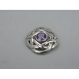 A Silver Celtic Knot Brooch Set with an Amethyst - 8 grams