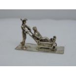 A Dutch Silver Miniature of a Sleigh with a Lady Passenger - Hallmarked with a Makers Mark 'XXX',