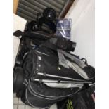 Large Quantity of Golf Bags, Trolleys and Stands