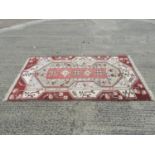 Hand Knotted Patterned Rug - 89" x 52"