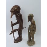 Carved Treen Ornament and One Other - Both Depicting Men with Staffs