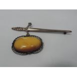 2x Vintage Brooches - One Butterscotch Amber and One Silver Sword Kilt Pin