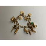 9ct Gold Bracelet with 11x Charms - 31gms