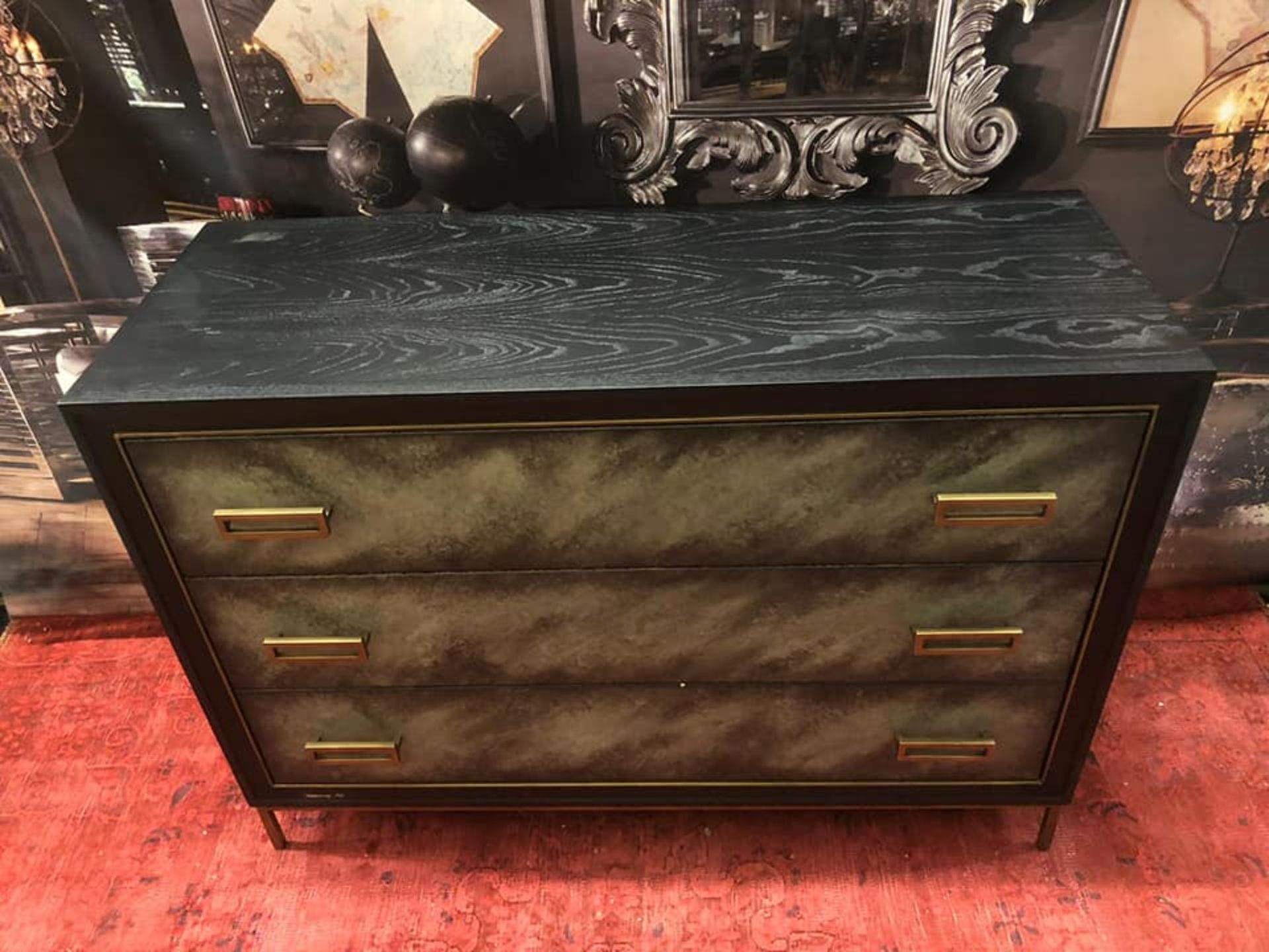 Levi Chest wrapped in a a faux velum on leather in a charcoal finish on satin brass finished metal