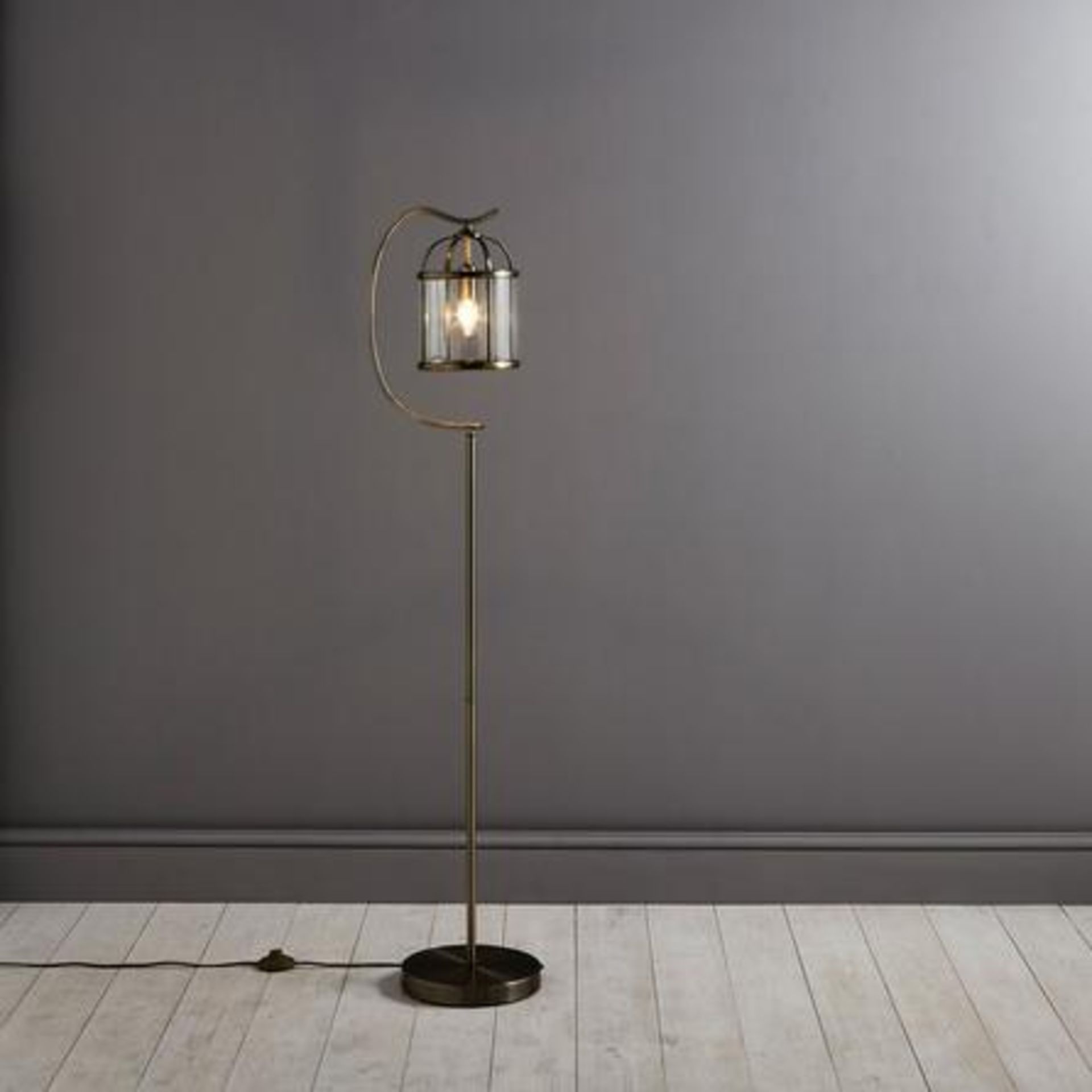 Hurricane Floor Lamp This Traditional Antique Brass Floor Lamp Is Designed With A Slim Metal Stand