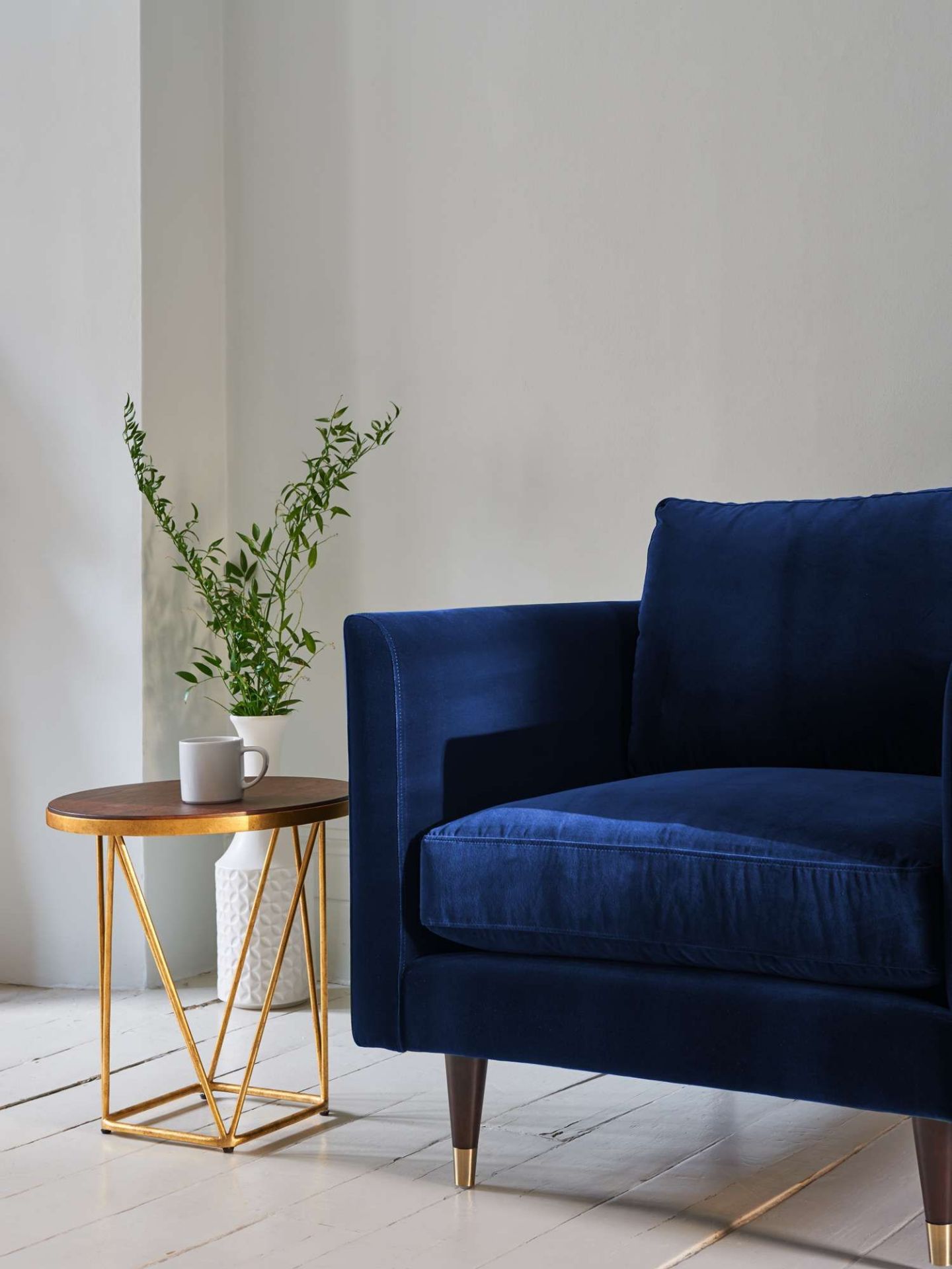 Henry Velvet Armchair Navy Blue Henry by Christiane Lemieux is a contemporary sofa and armchair