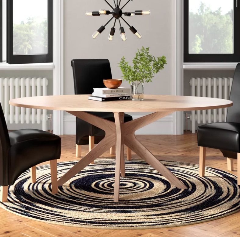 Silhouette Dining Table Featuring An Eye-Catching Silhouette And An Oak Finish This Dining Table