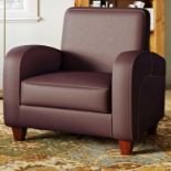 Silhoutte Club Chair With its streamlined silhouette, brown finish and faux leather upholstery, this