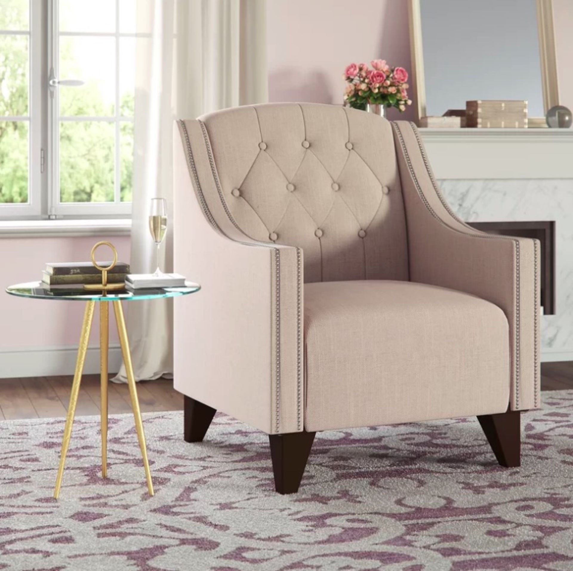 Regency Armchair Channelling classic elegance, this button-tufted armchair features versatile