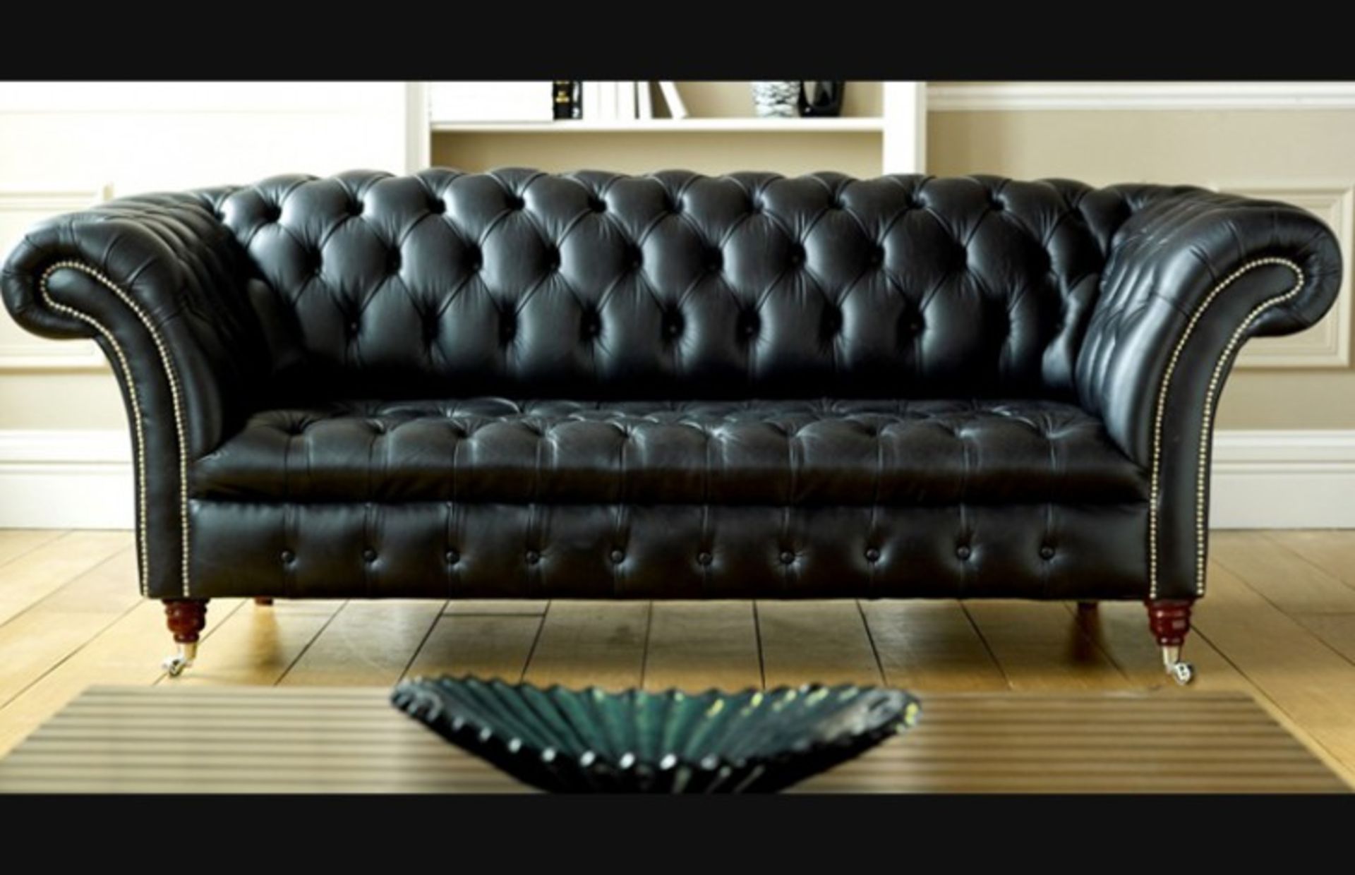 Knighstbridge A 3 seater black leather chesterfield is a graceful and elegant piece of furniture