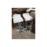 A Pair Of White Leather Adjustable Height Chrome Bar Stools