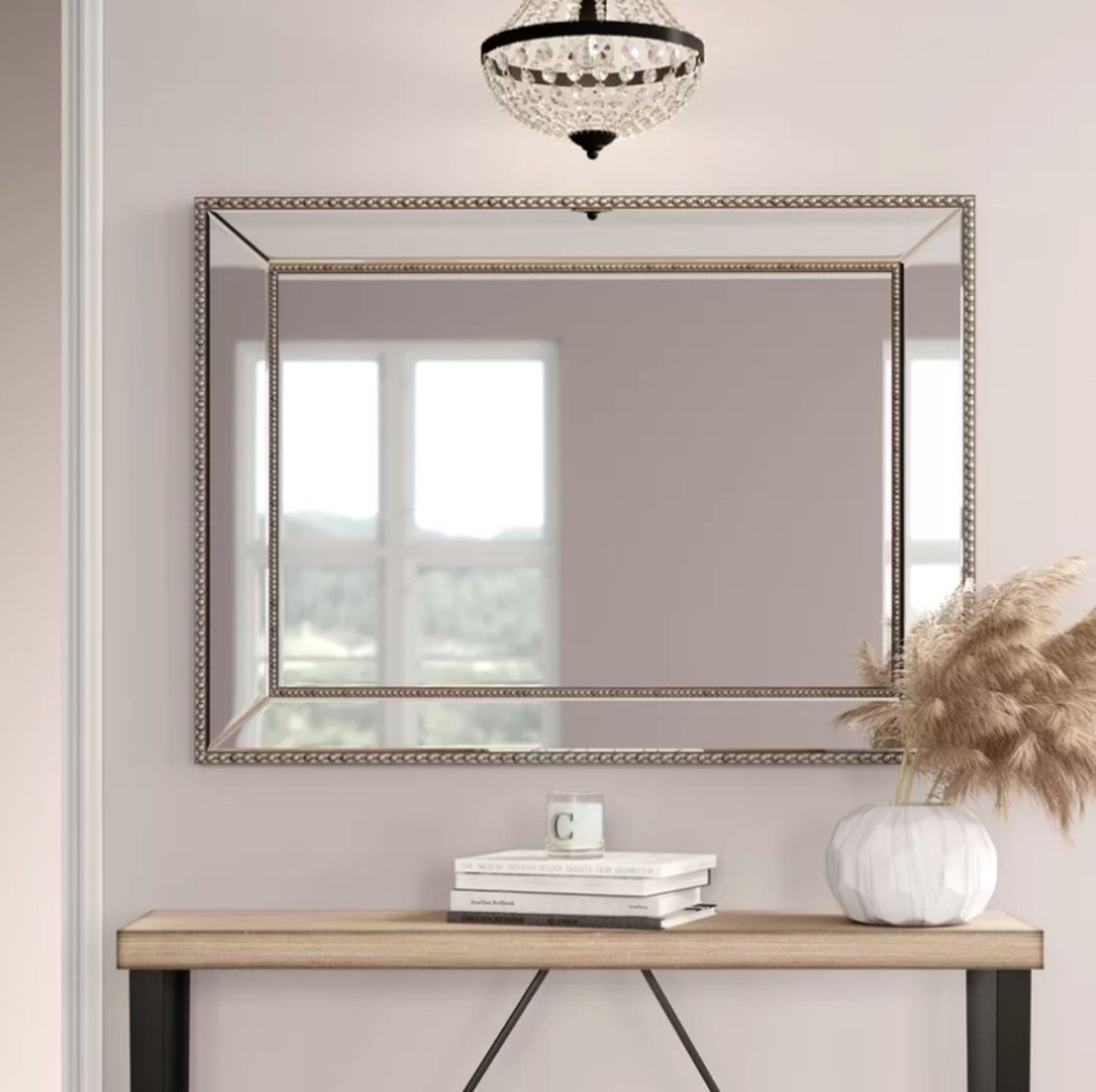 Elegant Wall Mirror This beaded wall mirror will add an elegant finishing touch to your room