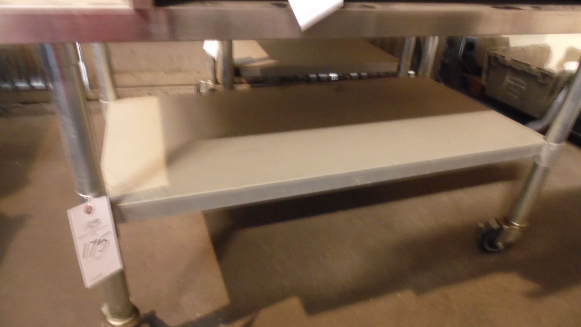 STAINLESS ROLLING TABLE 38" X 28"
