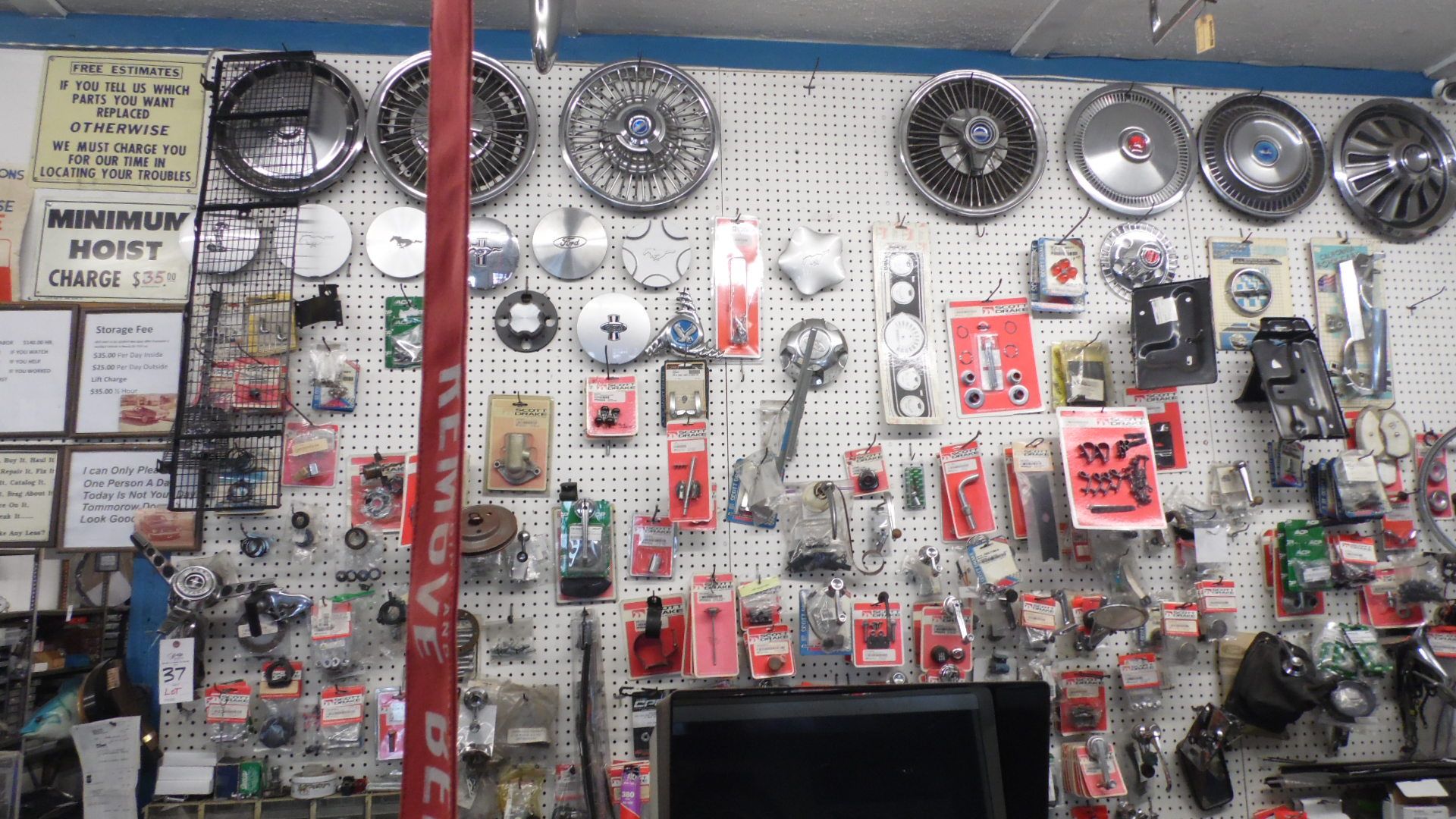 CONTENTS ON PEG BOARD WHEEL MIRRORS, HUBCAPS, HANDLES, MOUNTIN KITS