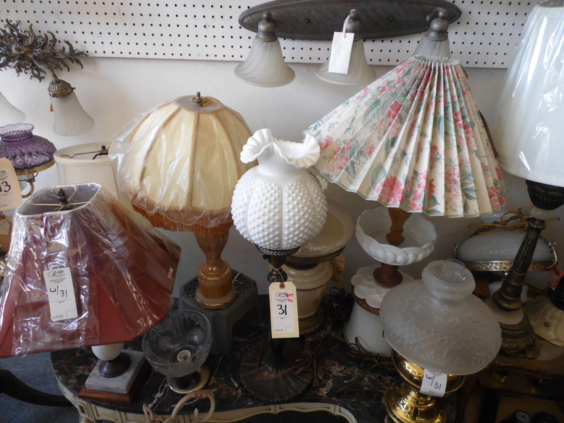 ASSORTED LAMPS ON TABLE