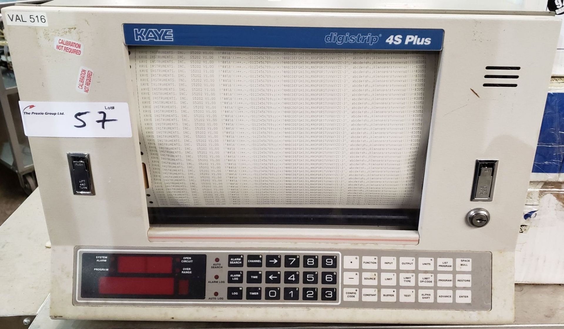 Kaye Digistrip Validator, Model 4S, with (2) boxes of printer paper.