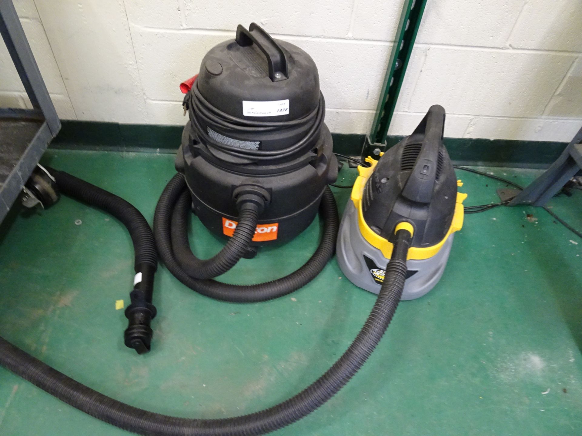 (1) Lot Of (4) Industrial Shop Vacs Including: (1) Ridgid, (2) Dayton, (1) Stinger