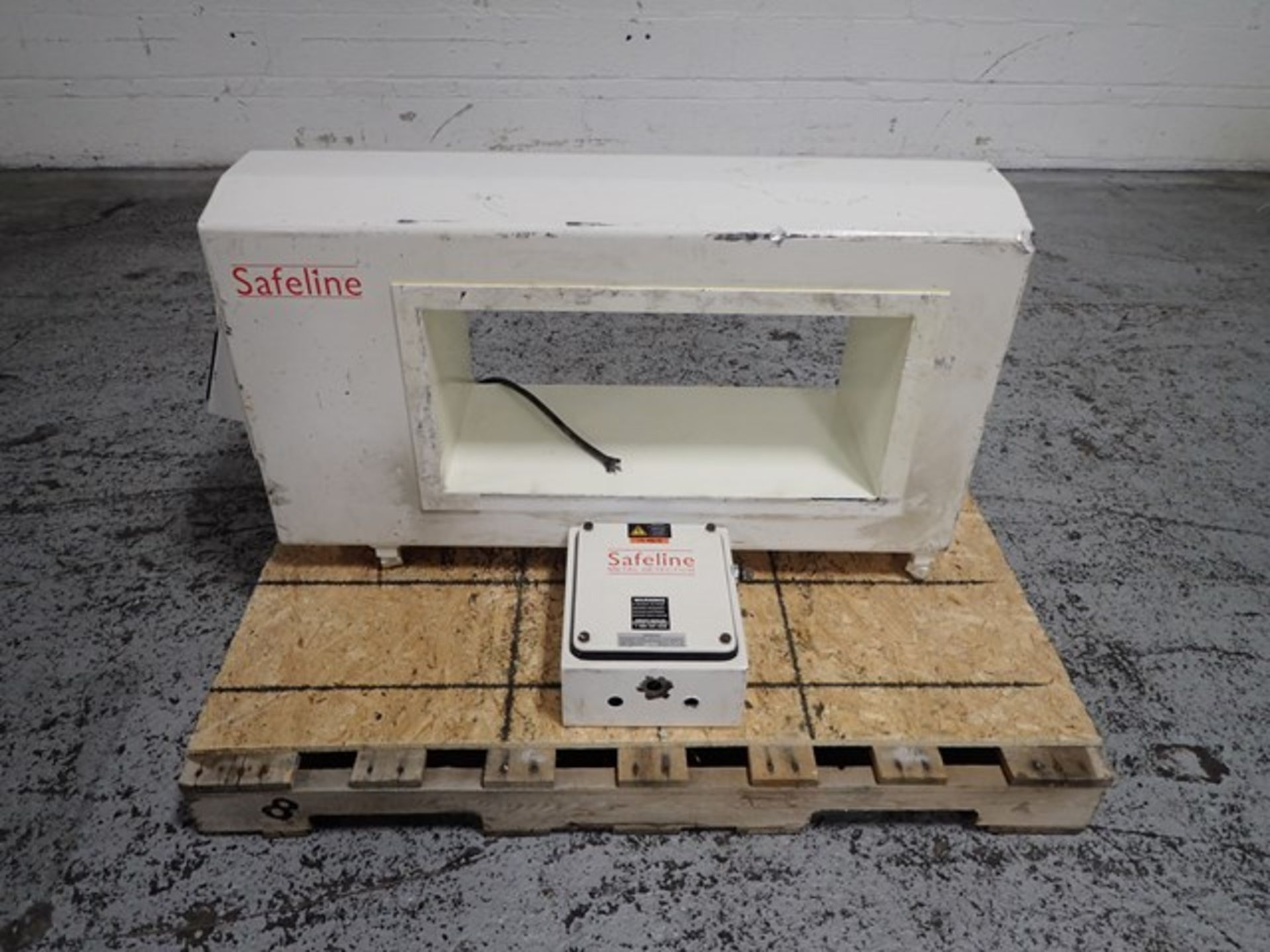 Safeline pass-thru metal detector, 25" long x 12" high x 12" width aperture, with controls on unit.