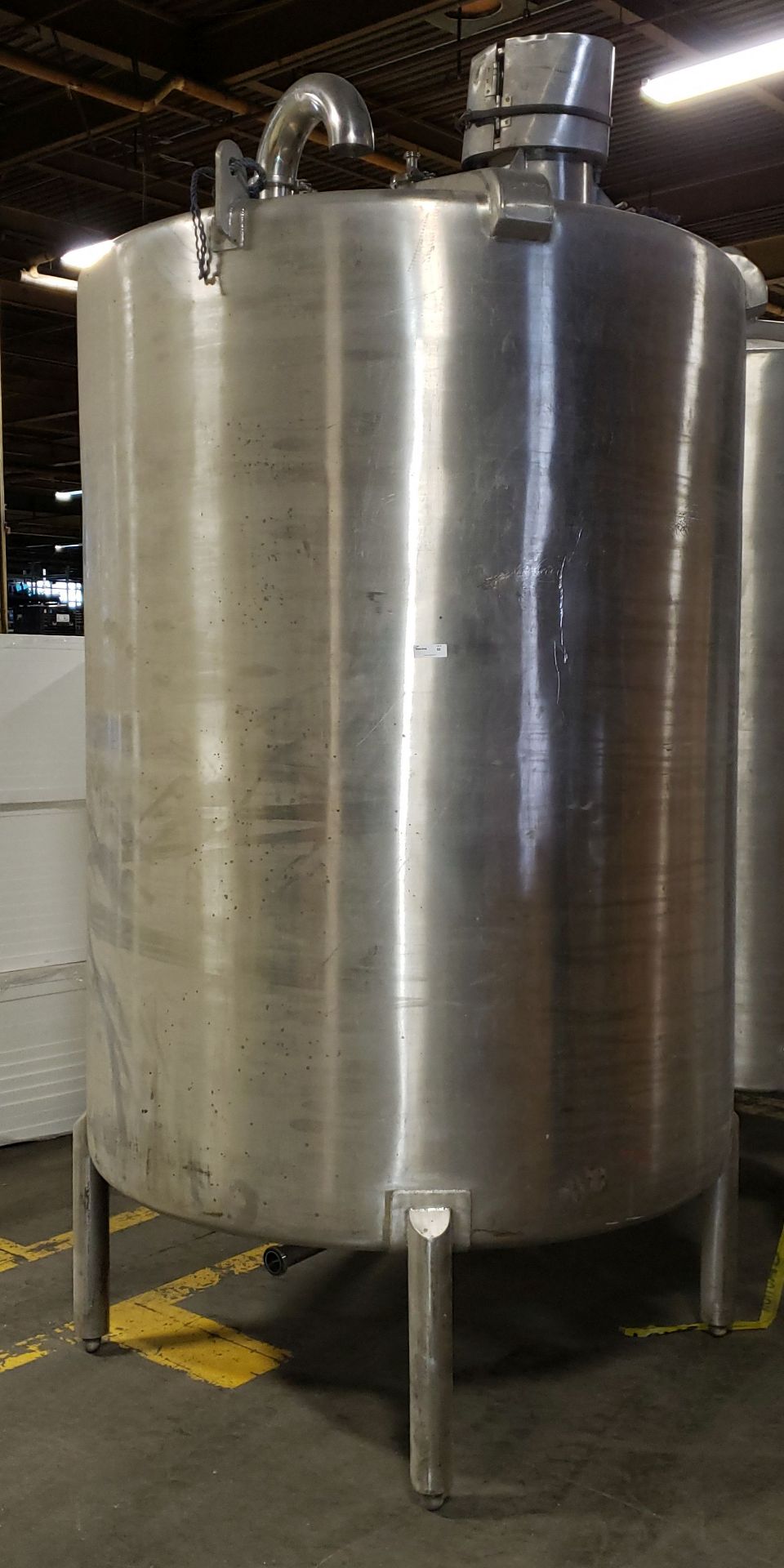 4,322L (1150 Gallon USG) Stainless Steel Tank, on 4 legs, closed top w/ manhole **Auctioneers Note**