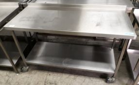 Stainless steel table on wheels - 150 x 65cm.