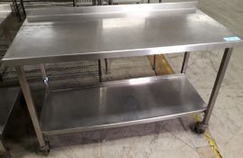 Stainless steel table on wheels - 130 x 60cm.