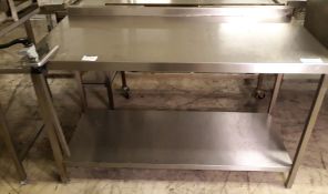 Stainless steel table fitted with Bonzer can opener - 147 x 69cm.