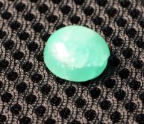 One Cabochon Emerald. Weight 4.95 Carats.