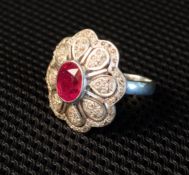 One Silver Diamond & Ruby Ring. Set With Eighty Round Single Cut Diamonds & With One Oval Ruby.