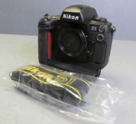 Nikon D1 Camera Body - no battery or cover - comes with D1 Strap