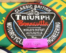 Triumph Cast Sign.