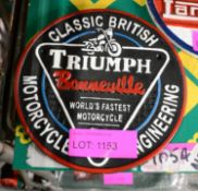 Triumph Cast Sign.