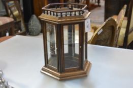 A 19th century glazed walnut table top display cabinet, of hexagonal form, with baluster gallery