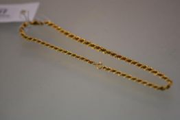 An 18ct gold ropetwist neck chain. Length 40.5cm. 14 grams