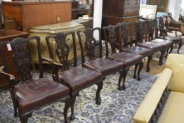 A set of eight Chippendale Revival mahogany dining chairs, c. 1900, comprising a pair of carvers and
