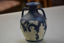 A Wedgwood blue dip jasper Portland vase, late 19th century, with characteristic sprigged decoration