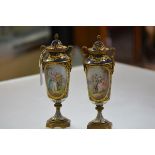 A pair of French gilt-metal mounted porcelain urns and covers, c. 1900, in 18th century style,