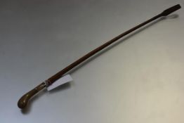 Swaine & Adeney, a rose-coloured metal mounted riding crop, the handle probably rhinoceros horn,