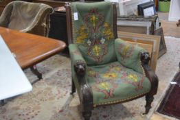 A Victorian mahogany framed library armchair, third quarter 19th century, the scroll-carved back