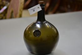 A green glass onion bottle, of spherical shape, with moulded seal bearing initials "JW" and date