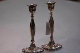 A pair of silver candlesticks in the Georgian taste, Birmingham 1991, each with scalloped oval