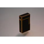 S. J. Dupont of Paris, a Lacque de Chine rose gold-plated pocket lighter, 1970's, in black enamel,