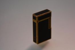 S. J. Dupont of Paris, a Lacque de Chine rose gold-plated pocket lighter, 1970's, in black enamel,