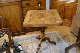 A Continental 19th century parquetry tripod table, the square top with cut-off corners, inlaid to