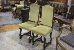 A matched pair of William and Mary walnut side chairs, late 17th century, each with shaped arched