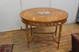 A painted satinwood table in 19th century style, mid-20th century, oval, the top centred by a