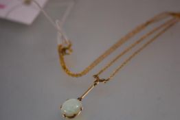 A 9ct gold opal pendant, early 20th century, the oval opal cabochon claw-set and suspended from a