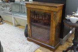 A mid-19th century gilt-metal mounted inlaid walnut pier cabinet, the rectangular top above an