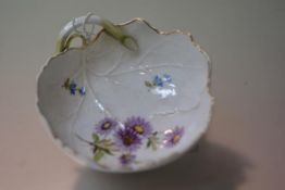 A Meissen porcelain pickle dish, 19th century, second quality, moulded as a leaf, painted with a